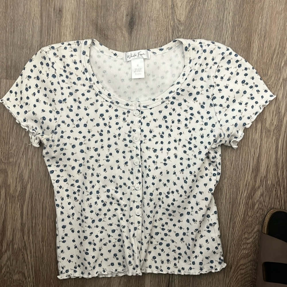 white fawn short sleeve top with blue flowers and button up
